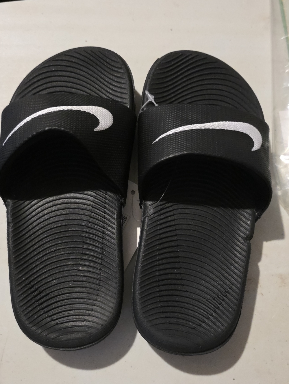 Nike Kids Black Slide Sandals with White Swoosh Logo